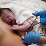 13153688 – newborn baby on his mothers arms right after delivery